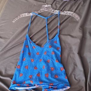 a cute tank top blue with red flowers and white dots and cute back